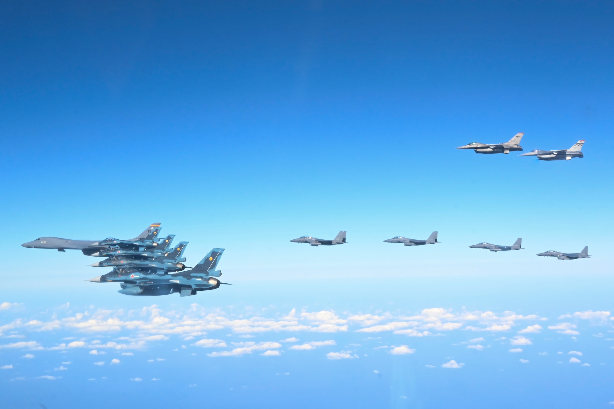 Fighter aircraft from the U.S., Japan, and the Republic of Korea conduct a trilateral escort flight of U.S. bombers operating in the Indo-Pacific, Nov. 3, 2024. Two U.S. F-16 from the 36th Fighter Squadron, 51st Fighter Wing flew with four Japan Air Self-Defense Force F-2s from the 8th Air Wing and four Republic of Korea Air Force F-15Ks from the 11th Fighter Wing to escort one U.S. Air Force B-1B Lancer. (U.S. Air Force photo by Senior Airman Maria Umanzor Guzman)