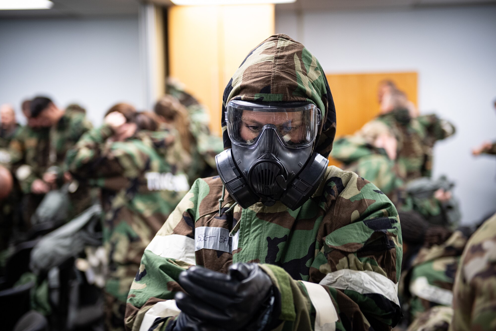 A 193rd Special Operations Wing Airman dons protective gear during chemical, biological, radiological, nuclear and explosive (CBRNE) training at Middletown, Pennsylvania, Nov. 3, 2024.