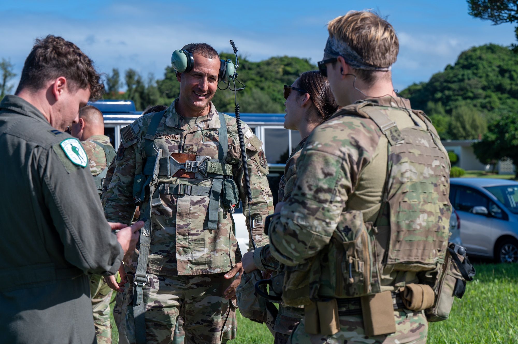 military member smiles to his comrades