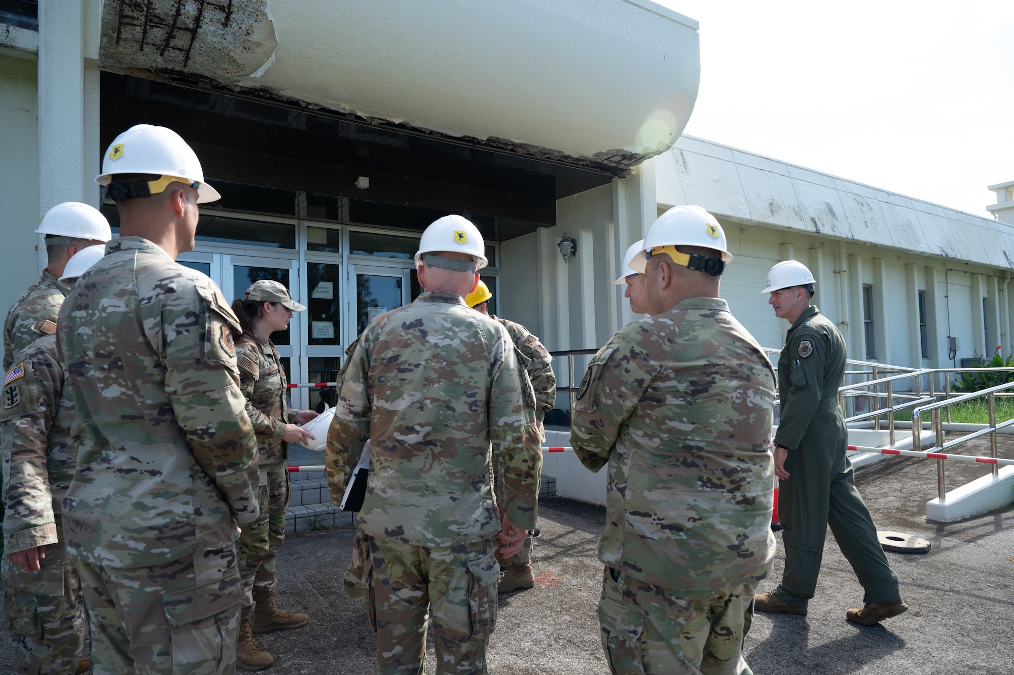 Group of U.S. Military Airman stand in front of chapel one