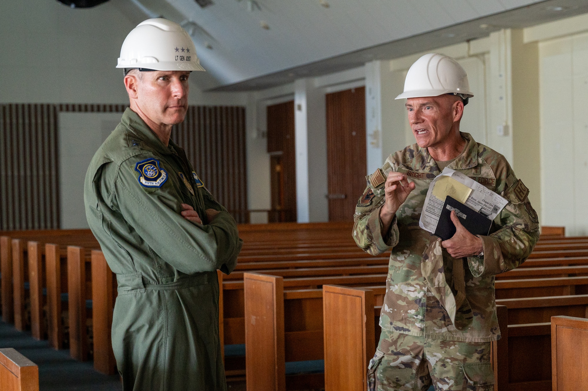 Two military members are standing in the Chapel
