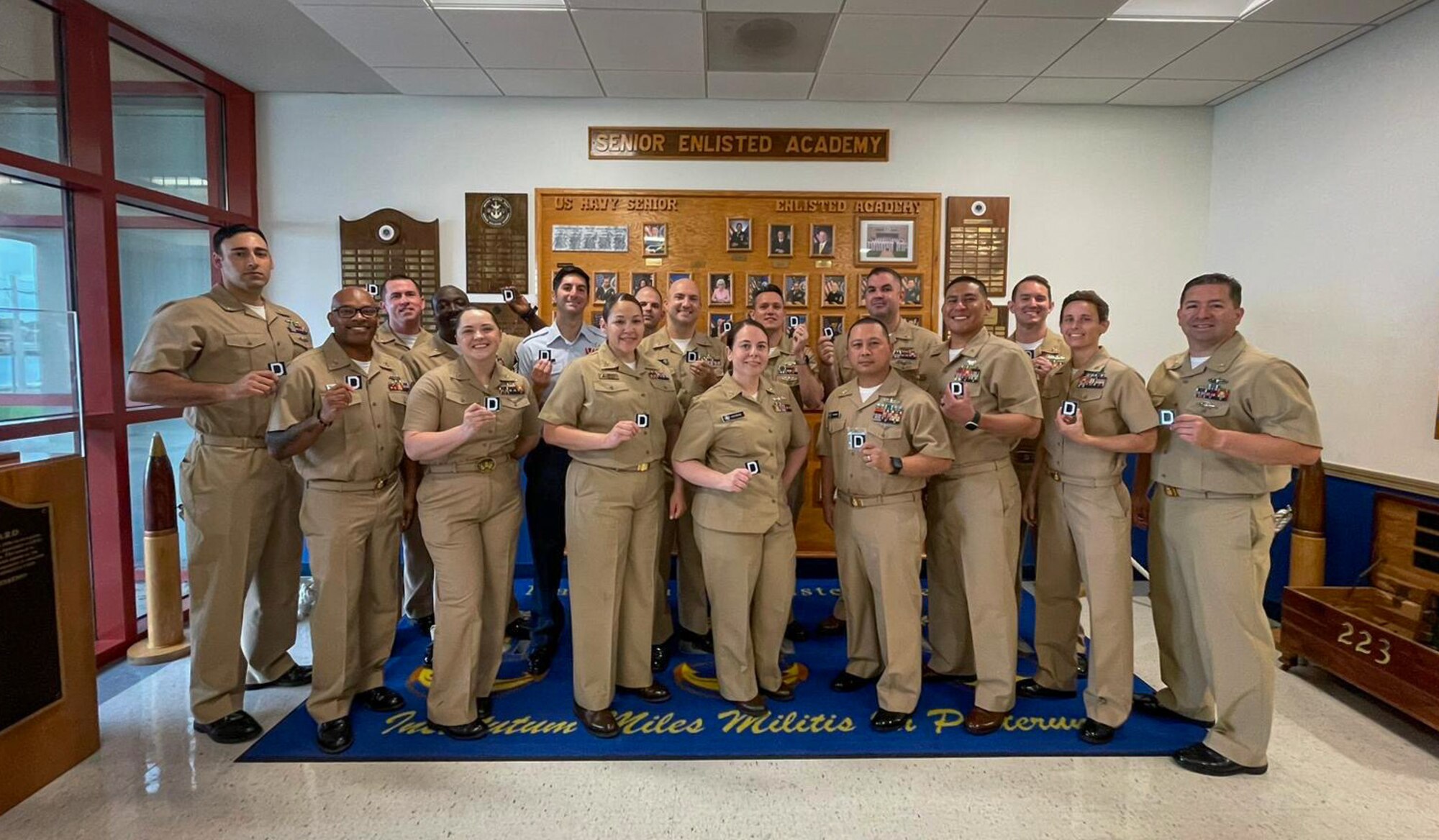 U.S. Navy Senior Enlisted Academy class 276, Green Horizon, stands together with newly received coins at Newport, Rhode Island, August, 2024.