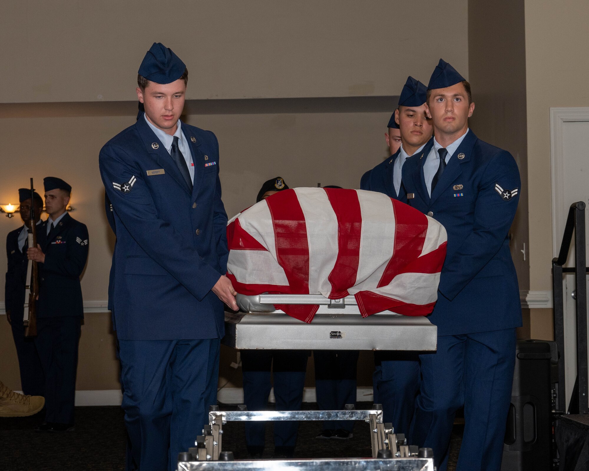 Seymour Johnson Air Force Base Honor Guard graduates demonstrate pallbearing during an honor guard graduation ceremony.