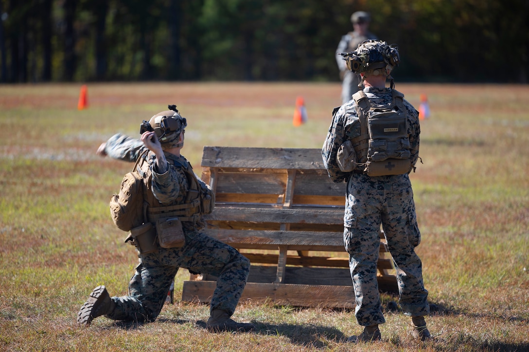 U.S. Marine Corps Sgt. Logan Elkins, left, from Ohio, with 3rd Battalion, 6th Marine Regiment, and Sgt. Hobart Whitman, from Tennessee with 2nd Light Armored Reconnaissance Battalion, both infantry riflemen, participate in simulated grenade throwing drills at Marine Corps Base Camp Lejeune, North Carolina, Oct. 21, 2024. U.S. Marines with Marine Wing Headquarters Squadron (MWHS) 2, Marine Light Attack Helicopter Squadron (HMLA) 269, and HMLA-167 participated in small-unit training and live-fire ranges to support the Infantry Small Unit Leader’s Course (ISULC).  The training reinforced basic infantry skills for junior Marines and noncommissioned officers with 2nd Marine Aircraft Wing and provided ISULC students with experience in leading Marines from non-infantry military occupational specialties. (U.S. Marine Corps photo by Lance Cpl. Bryan Giraldo)