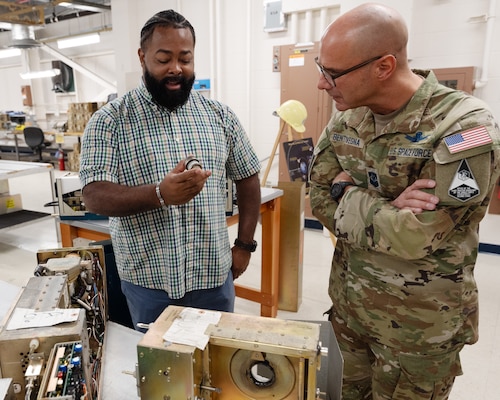 Famario Dawson, 20th Space Surveillance Squadron radar maintenance lead, describes the final tube function from an AN/FPS-85 Transmitter Module to Chief Master Sgt. of the Space Force John Bentivegna.