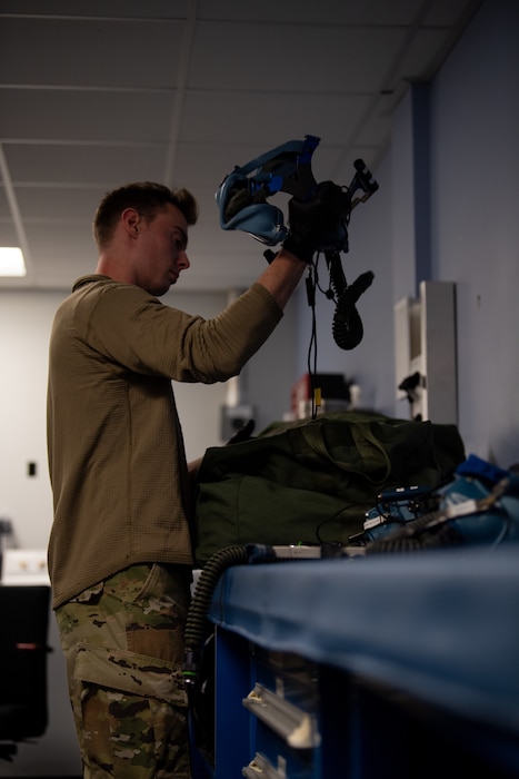 U.S. Airman 1st Class Samuel Harris, 436th Operation Support Squadron Aircrew Flight Equipment technician, sorts masks in the inspection room at Dover Air Force Base, Delaware, Oct. 29, 2024. The AFE team provides inspections and maintenance for flight safety equipment such as parachutes, emergency escape slides and life rafts for the C-5M Super Galaxy and C-17 Globemaster III. (U.S. Air Force photo by Airman 1st Class Liberty Matthews)