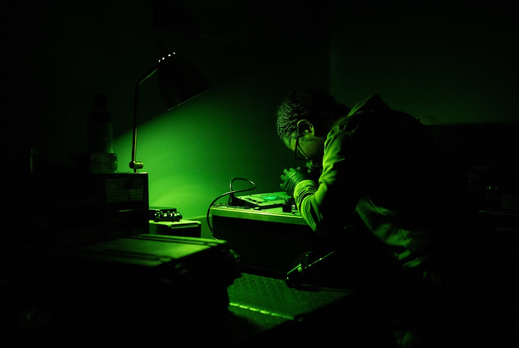 U.S. Air Force Senior Airman Faith Moss, 436th Operation Support Squadron Aircrew Flight Equipment technician, inspects a pair of night vision goggles at the AFE warehouse at Dover Air Force Base, Delaware, Nov. 1, 2024. The AFE team provides inspections and maintenance for flight safety equipment such as parachutes, emergency escape slides and life rafts for the C-5M Super Galaxy and C-17 Globemaster III. (U.S. Air Force photo by Airman 1st Class Liberty Matthews)