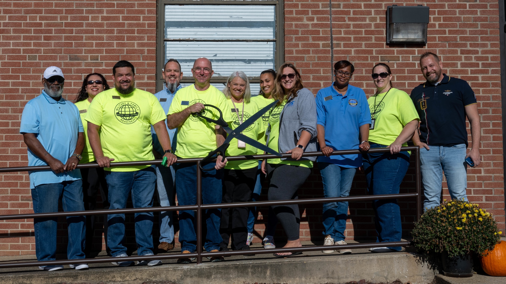 Military and Family Readiness Center personnel pose for a photo in front of the new work center at Seymour Johnson Air Force Base.