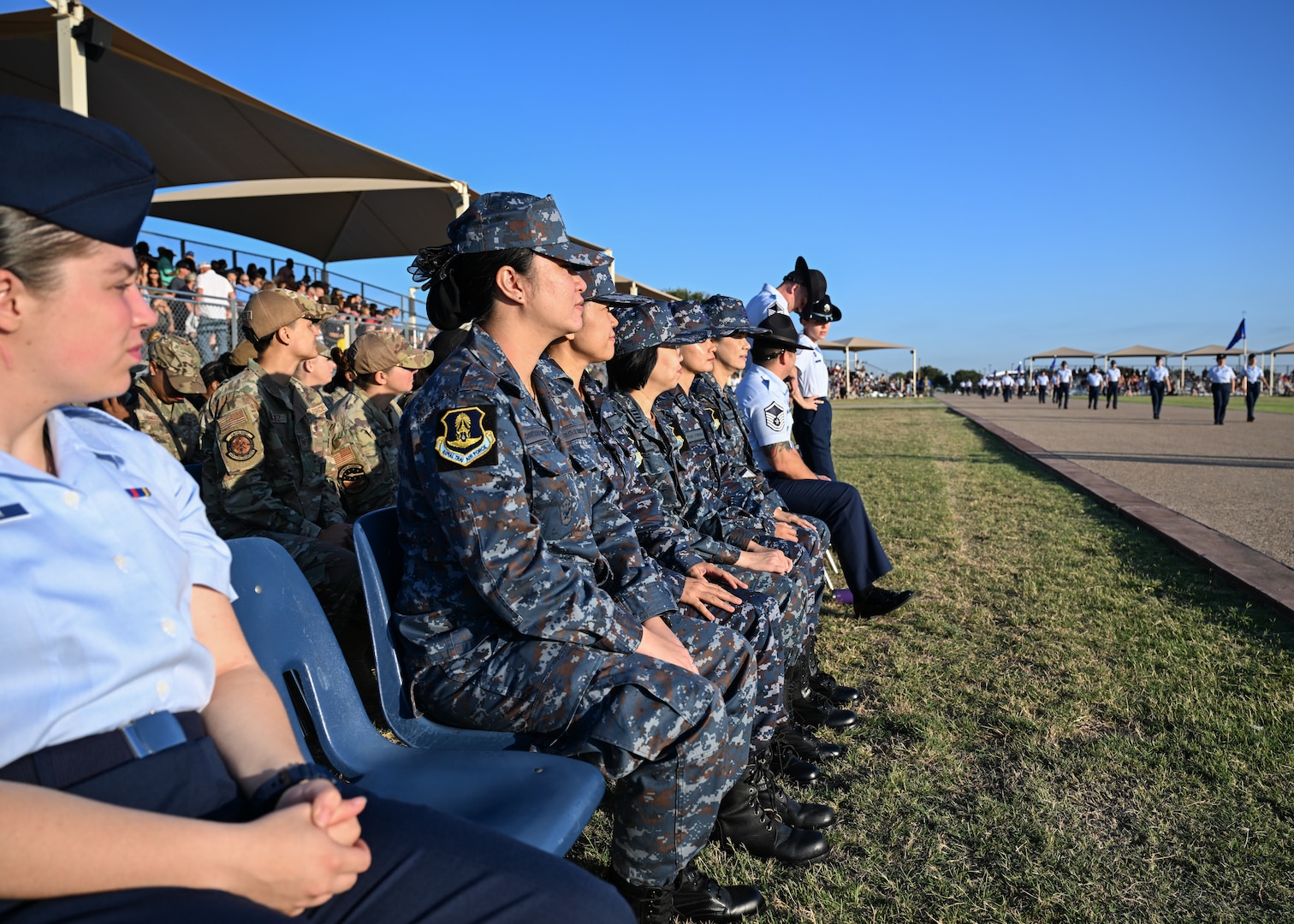 Royal Thai Air Force nurses observe a Basic Military Training graduation at Joint Base San Antonio-Lackland, Texas September 12, 2024.