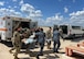 Royal Thai Air Force nurses assist U.S. Air Force medical personnel during a patient transport training exercise on the flight line at Kelly Airfield in San Antonio, Texas.