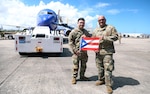 U.S. Sgt. Hassani Ribera assigned to the 113th Mobile Public Affairs Detachment, 101st Troop Command, and 1st Sgt. Jorge Ribera of the 755th Military Police Company, 92nd military Police Brigade, Puerto Rico Army National Guard, pose for a photo at Luis Muñoz Marín International Airport, San Juan, Puerto Rico, Nov. 3, 2024.