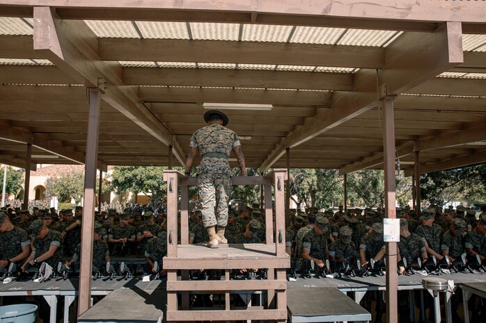 U.S. Marine Corps Sgt. Rafael Garcia Jr., a drill instructor with India Company, 3rd Recruit Training Battalion, observes recruits cleaning rifles during a M16A4 service rifle de-issue at Marine Corps Recruit Depot San Diego, California, Oct. 23, 2024. After carrying their rifles throughout recruit training the new Marines will properly clean and de-issue their rifles to extend the life of the rifles and allow more time to maintain them for future recruits. (U.S. Marine Corps photo by Cpl. Sarah M. Grawcock)