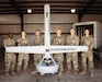 Soldiers from 3rd Brigade Command Team, 101st Airborne Division, and Army Applications Group, 75th U.S. Army Reserve Innovation Command, gather behind a V-BAT, a Vertical Take-Off and Landing unmanned aerial vehicle, after a successful demonstration of its autonomous capabilities Sept. 17, 2024, at Yuma Proving Ground, Arizona. Approximately 10 Soldiers from the 75th USARIC participated in EDGE24, an Army exercise focused on integrating unmanned systems, data-sharing innovations and network resilience to strengthen air-combat capabilities in complex environments. Through direct collaboration with industry experts at Yuma Proving Ground, the Soldiers provided frontline insights to refine these cutting-edge technologies, bridging the gap between concept and real-world application (U.S. Army photo by Sgt. 1st Class John Carkeet, 75th USARIC)