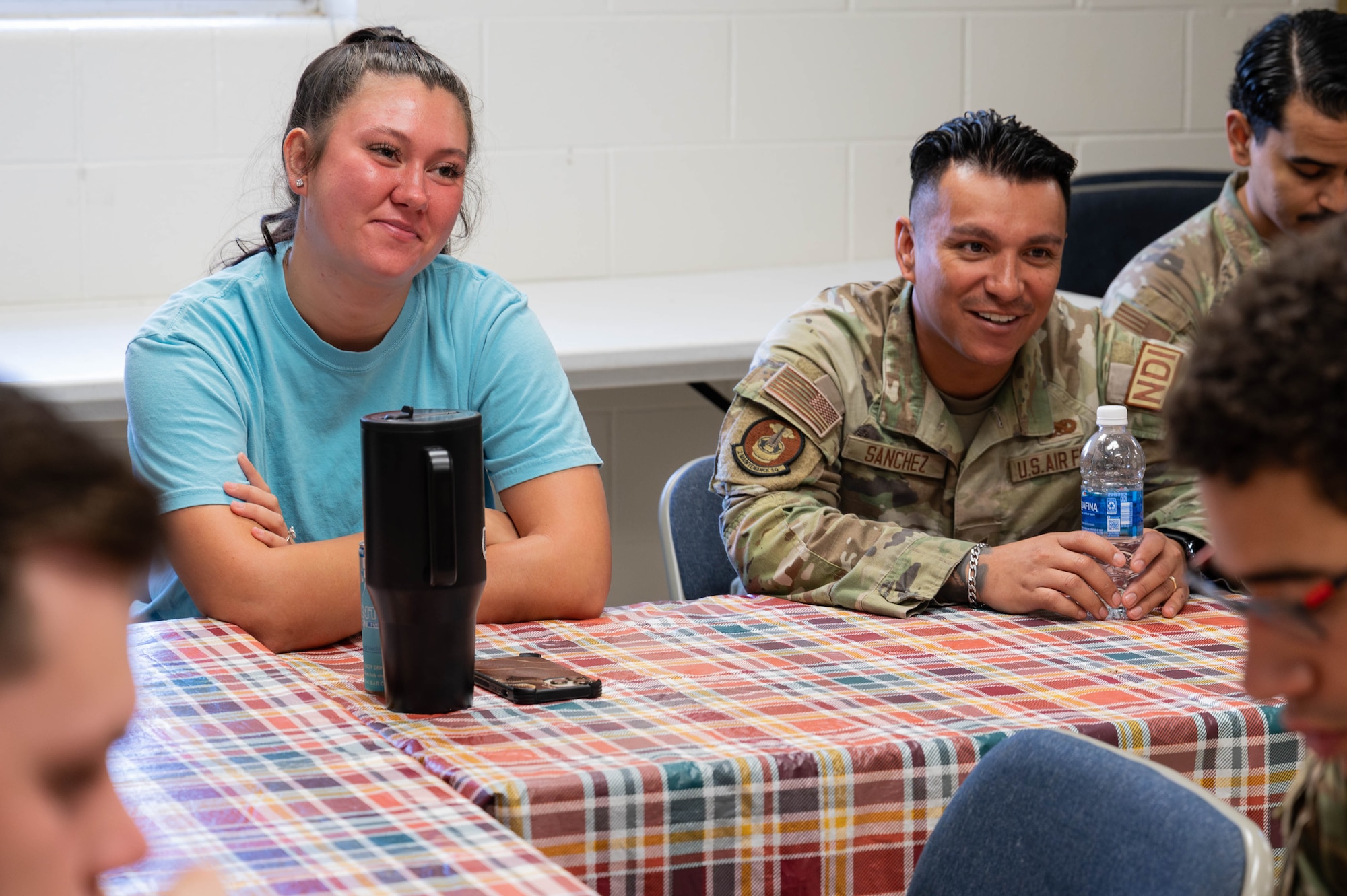 Airman 1st Class Jada Duke and Senior Airman Eduard Sanchez have a discussion about the HOPE Initiative.