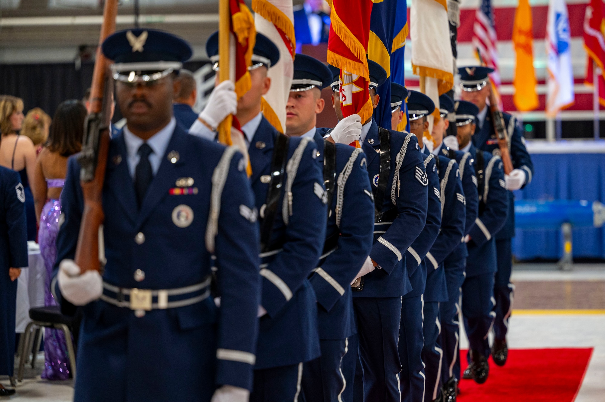 Airmen from the Steel Talons Honor Guard depart after presenting the colors during the 2024 Holloman Air Force Ball at Holloman Air Force Base, New Mexico, Nov. 2, 2024.