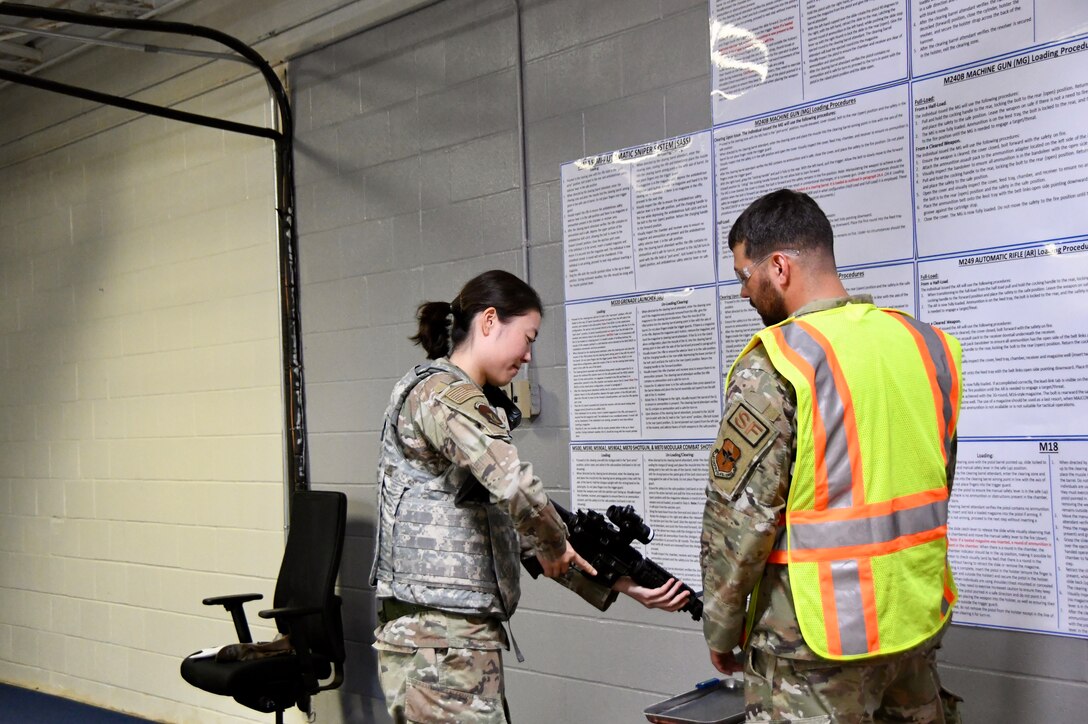 Airmen checks a weapon during a Mission Ready Airman exercise Oct. 21-24, 2024, at Sheppard Air Force Base, Texas.