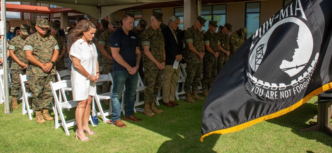 U.S. service members and distinguished guests bow their head during the invocation on Joint Base Pearl Harbor-Hickam, Hawaii, Oct. 31, 2024. DPAA Marines were joined by Marine Corps Forces, Pacific senior leaders and DPAA senior leadership to celebrate the 249th Marine Corps birthday, highlighting the overlap of commitment, pride, and professionalism these two organizations share. DPAA's mission is to provide the fullest possible accounting of U.S. personnel to their families and the nation. (U.S Marine Corps photo by Sgt. Lesley Cisneros)