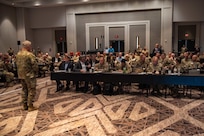 Commander talking to group of people