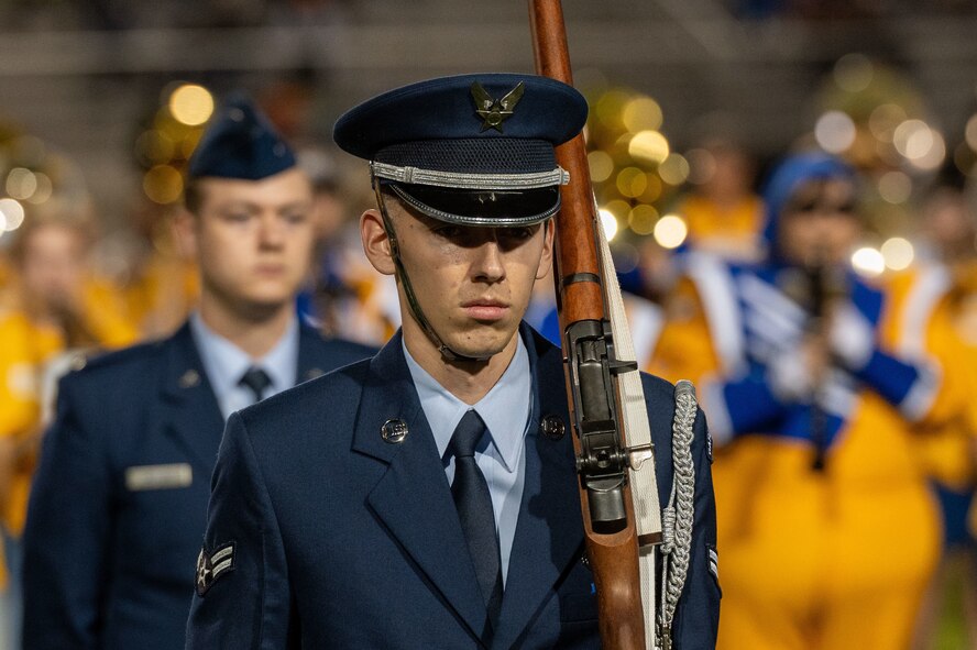 Airman 1st Class Matthew Alvizo, Goodfellow Air Force Base Joint Service Color Guard member, participates at the annual Angelo State University Military Appreciation Game at the 1st Community Credit Union Field at LeGrand Stadium, San Angelo, Texas, Nov. 2, 2024. The Joint Service Color Guard team is charged with upholding exemplary standards of ethical conduct, professionalism, integrity, customs and courtesies, and overall appearance.  (U.S. Air Force photo by Airman 1st Class James Salellas)