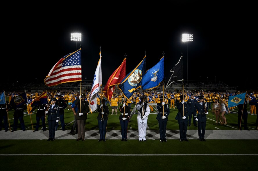 The Goodfellow Air Force Base Joint Service Color Guard presents each service flag during the halftime show during the Angelo State University Military Appreciation Game at the 1st Community Credit Union Field at LeGrand Stadium, San Angelo, Texas, Nov. 2, 2024. Volunteers from Goodfellow presented the state flags at halftime, U.S. Air Force Col. Angelina Maguinness, 17th Training Wing Commander, administered the oath of enlistment to Delayed Entry Program recruits to make the first play of their journey in joining the world’s greatest Air Force. (U.S. Air Force photo by Airman 1st Class Madi Collier)