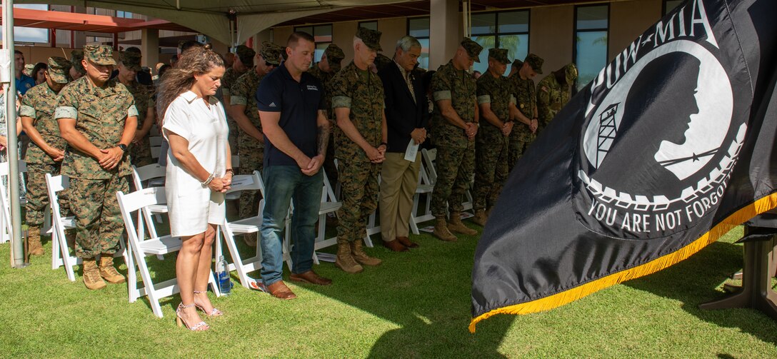 U.S. service members and distinguished guests bow their head during the invocation on Joint Base Pearl Harbor-Hickam, Hawaii, Oct. 31, 2024. DPAA Marines were joined by Marine Corps Forces, Pacific senior leaders and DPAA senior leadership to celebrate the 249th Marine Corps birthday, highlighting the overlap of commitment, pride, and professionalism these two organizations share. DPAA's mission is to provide the fullest possible accounting of U.S. personnel to their families and the nation. (U.S Marine Corps photo by Sgt. Lesley Cisneros)