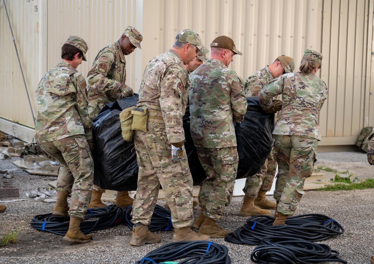 U.S. Air Force Chief Master Sergeants execute a simulated spoke operation during the Senior Enlisted Leaders Mission Command Training at Andersen Air Force Base, Guam, Oct. 24, 2024. One section of the training had the senior enlisted leaders assembling a spoke operation and establishing communication with higher echelons while navigating simulated attacks from adversaries in austere conditions. (U.S. Air Force photo by Airman 1st Class Audree Campbell)