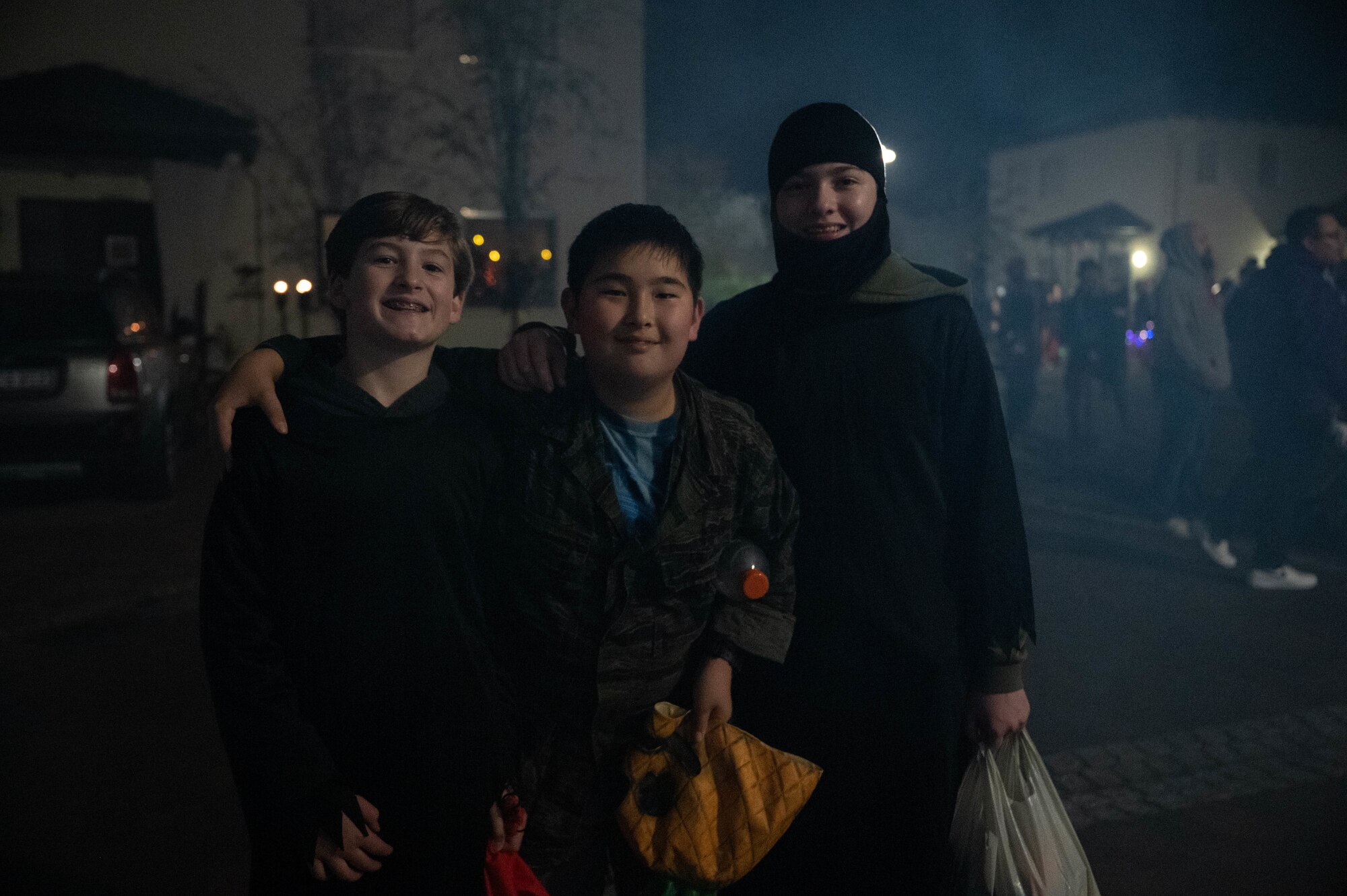 Kaiserslautern Military Community children pose for a photo while trick-or-treating.