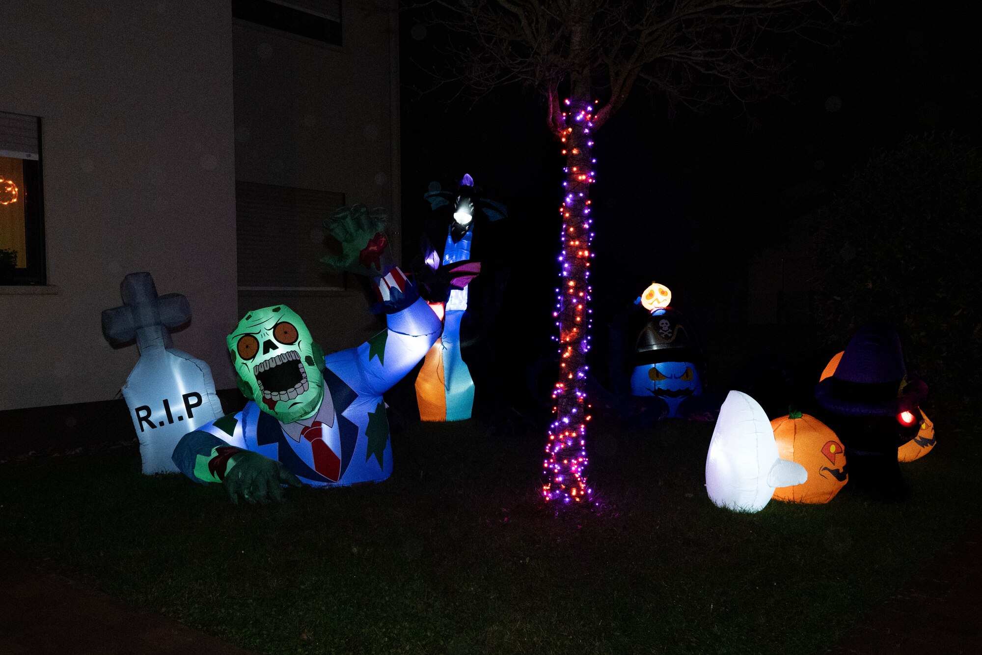 Halloween decorations sit outside of a home.