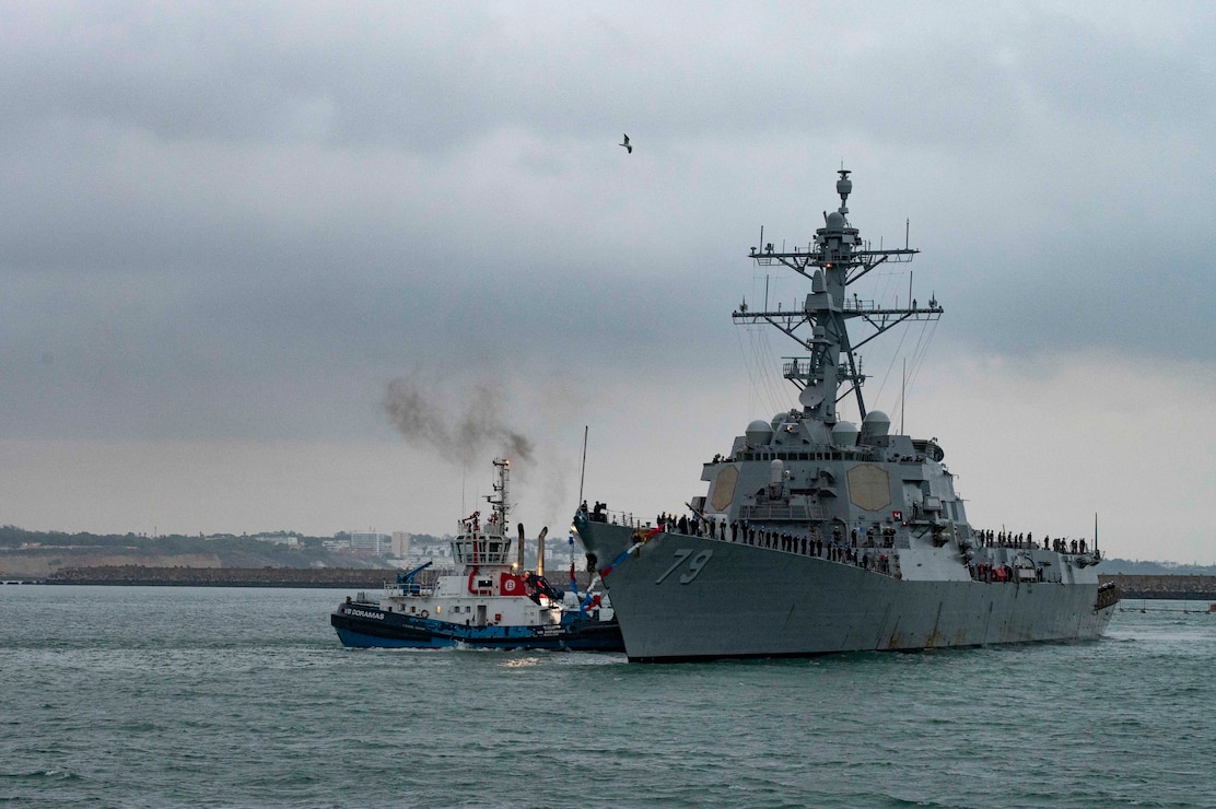 NAVAL STATION ROTA, Spain (Oct. 15, 2024) The Arleigh-Burke class guided-missile destroyer USS Oscar Austin (DDG 79) arrives to Naval Station (NAVSTA) Rota, Spain, completing its homeport shift to the installation from NAVSTA Norfolk, Va., Oct. 15, 2024. Oscar Austin is the first of two additional DDGs to join the Forward Deployed Naval Force-Europe (FDNF-E) force. As the "Gateway to the Mediterranean,” NAVSTA Rota provides U.S., NATO and allied forces a strategic hub for operations in Europe, Africa and the Middle East. NAVSTA Rota is a force multiplier, capable of promptly deploying and supporting combat-ready forces through land, air and sea, enabling warfighters and their families, sustaining the fleet and fostering the U.S. and Spanish partnership. (U.S. Navy photo by Mass Communication Specialist 2nd Class Drace Wilson)