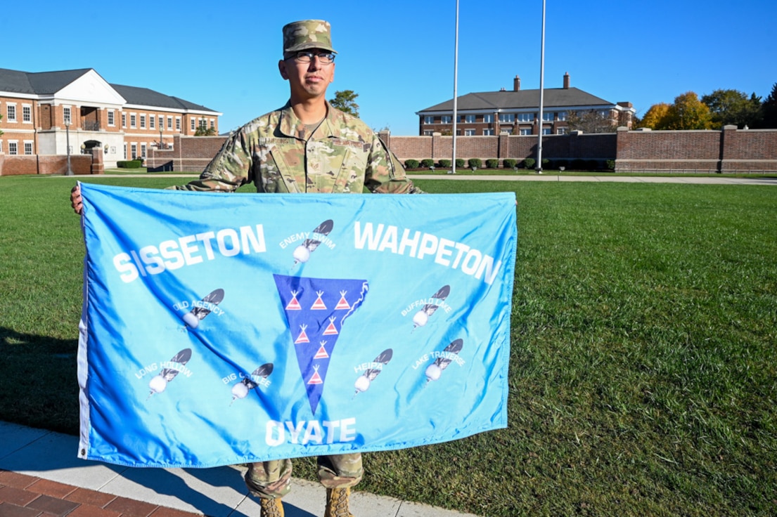 U.S. Air Force Staff Sgt. Wayne Lufkins, flight instructor for the U.S. Air Force Honor Guard, holds his native “Sisseton Wahpeton Oyate” flag on the Ceremonial Lawn on Joint Base Anacostia-Bolling, Washington, D.C., Oct. 25, 2024.