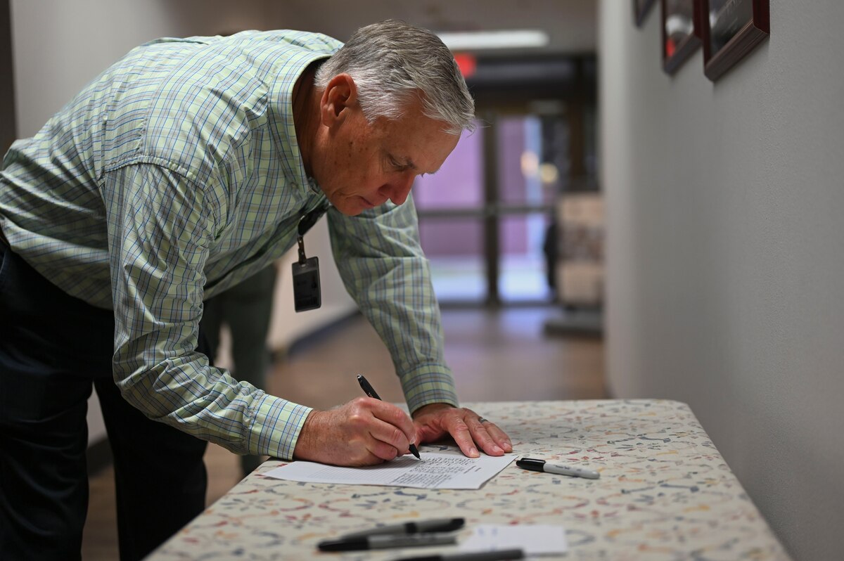 Stan Whites, Shannon Medical Center representative, signs in for Partners in Ministry Day at Taylor Chapel, Goodfellow Air Force Base, Texas, Nov. 1, 2024. The 17th Training Wing Chaplain Corps welcomed ministry partners from the San Angelo community for a day focused on strengthening support for Airmen and families stationed at Goodfellow. (U.S. Air Force photo by Airman 1st Class Madi Collier)