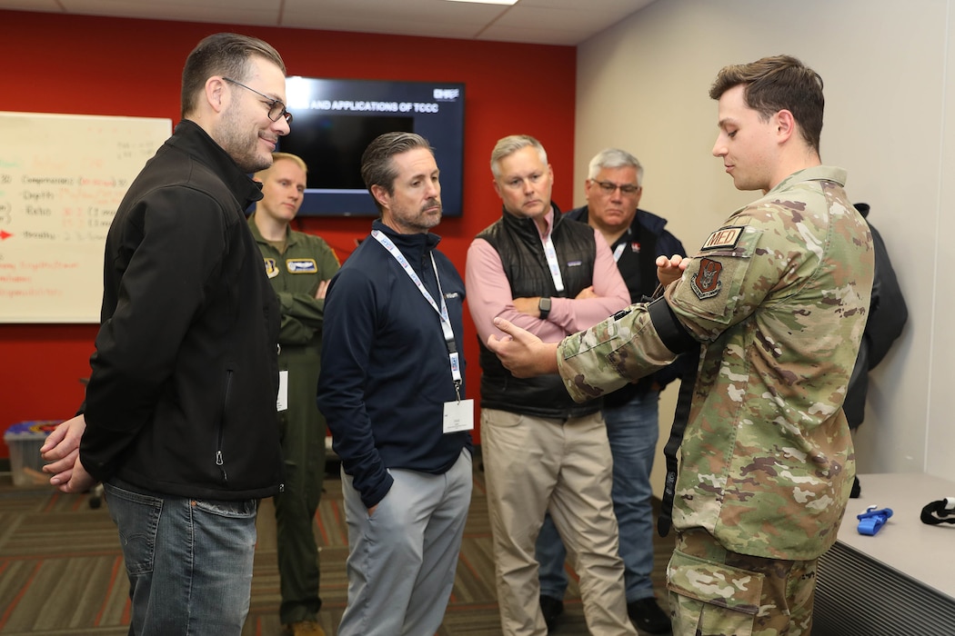 Senior Airman Jacoby Kinder, 445th Aeromedical Staging Squadron aerospace medical technician, explains tourniquet procedures during a Tactical Combat Casualty Care demonstration during Employer Appreciation Day at Wright-Patterson Air Force Base Nov. 2, 2024. (U.S Air Force photo/Senior Airman Angela Jackson)