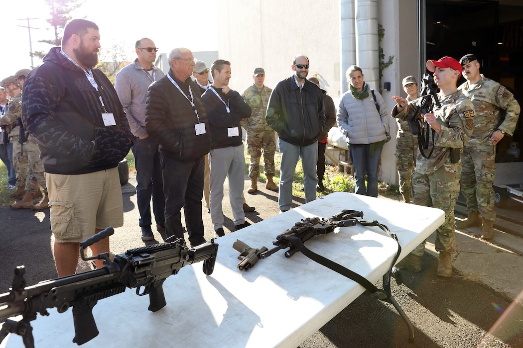 Staff Sgt. Jarrod Chaidez, 445th Security Forces Squadron fire team member, gives a demonstration on the various weapons used by SFS to employers participating in the 445th Airlift Wing 2024 Employer Appreciation Day Nov. 2, 2024. More than 40 employers were treated to breakfast and lunch and had the opportunity to participate in demonstrations by SFS, 445th Operations Support Squadron’s Aircrew Flight Equipment, 445th Aeromedical Staging Squadron and flew on a C-17 Globemaster III with 445th Aeromedical Evacuation Squadron Airmen on board providing demonstrations of what they do and allowing the employers to participate as patients.