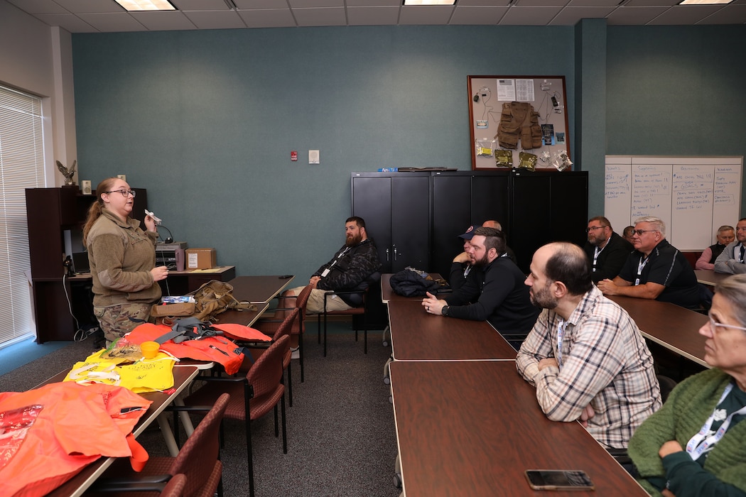 Staff Sgt. Gabrielle Saidak, 445th Operations Support Squadron Aircrew Flight Equipment Shop AFE craftsman, shows employers participating in the 445th Airlift Wing 2024 Employer Appreciation Day survival equipment her shop maintains for the wing's aircrew members. More than 40 employers of wing reservists were treated to breakfast and lunch and had the opportunity to participate in demonstrations by not only AFE but also 445th Security Forces Squadron, 445th Aeromedical Staging Squadron and they also flew on a C-17 Globemaster III with 445th Aeromedical Evacuation Squadron Airmen on board providing demonstrations of what they do and allowing the employers to participate as patients.