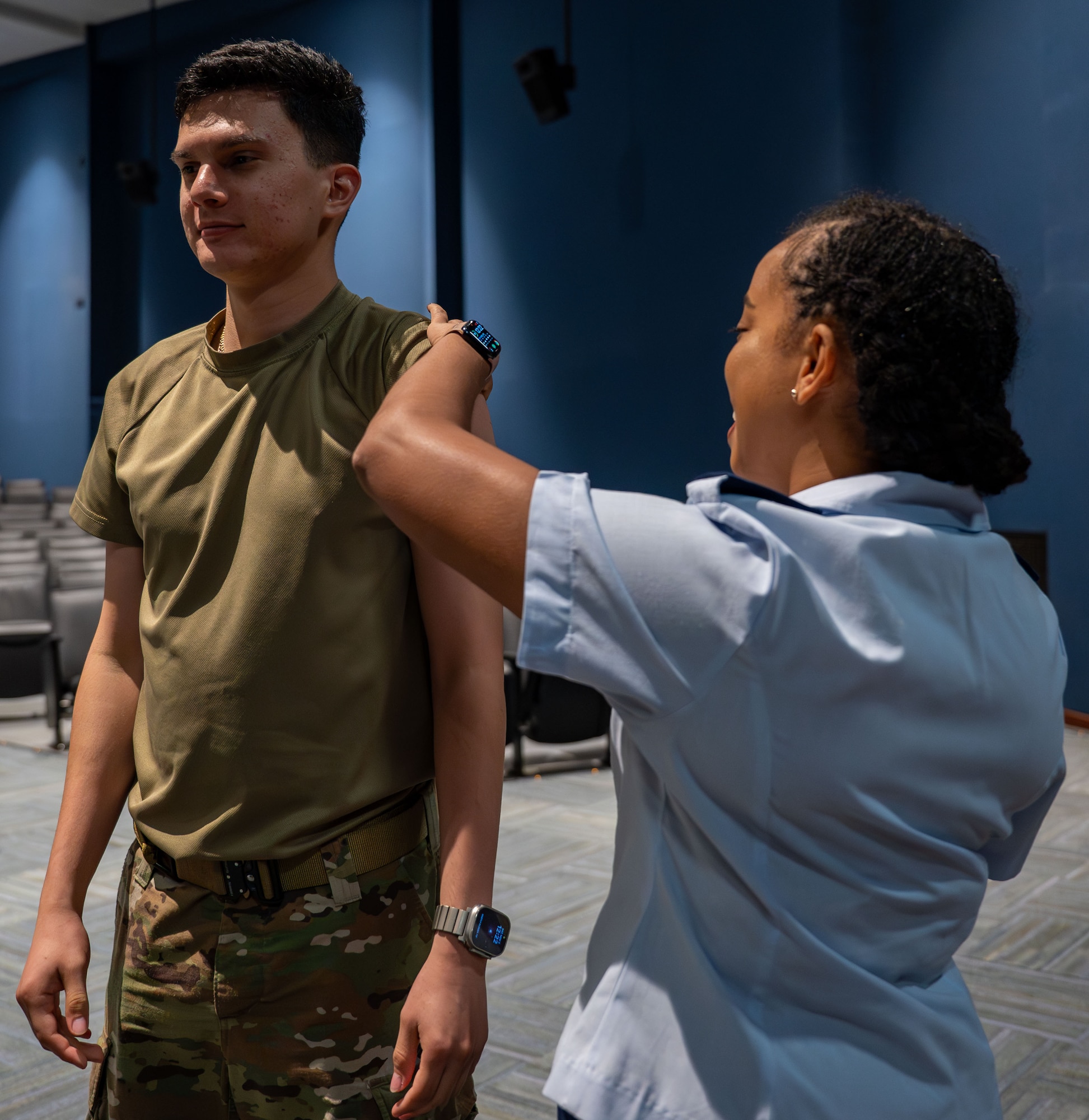 A 920th Aeromedical Staging Squadron clinical nurse, administers a dose of the influenza vaccine to a 920th Rescue Wing Airman