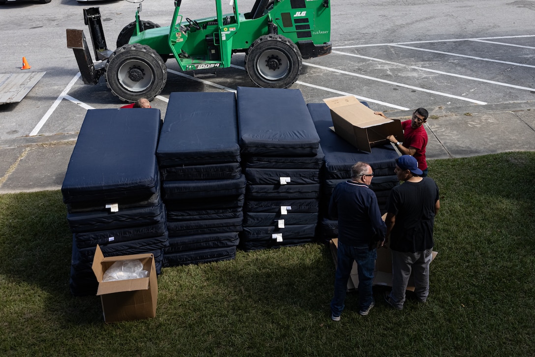Old mattresses are laid in front of Building HP-55, before being discarded, on Marine Corps Base (MCB) Camp Lejeune, North Carolina, Oct. 22, 2024. Marines assigned to H&S Battalion received new mattresses, blinds, and linens as part of an initiative to enhance the quality of life among Marines who live in Bachelor Enlisted Quarters. (U.S. Marine Corps photo by Cpl. Loriann Dauscher)