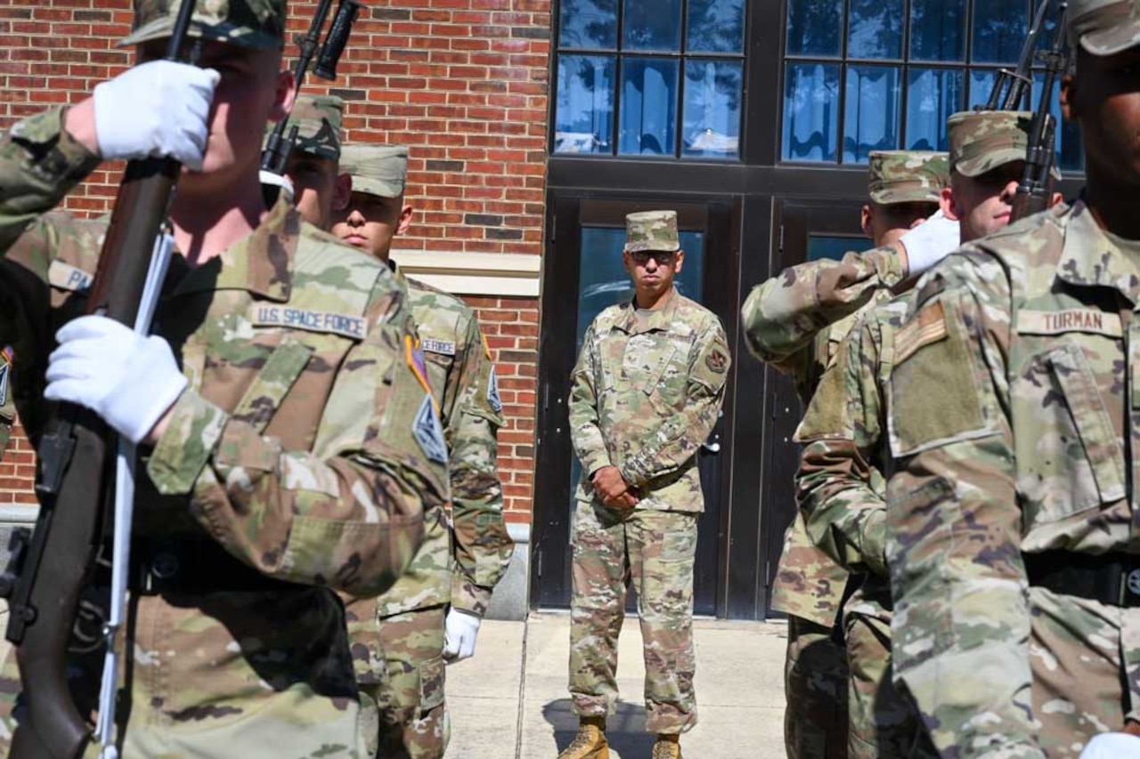 A group if service members stand in formation.