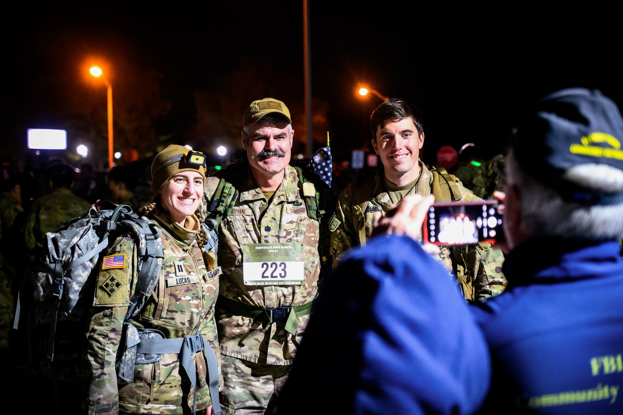 Service members assigned to Joint Base McGuire-Dix-Lakehurst pose for a photo during the Norwegian Foot March at JB MDL, N.J., Oct. 13, 2024. The Norwegian Foot March is a military endurance test where participants march or run an 18.6-mile-long route, carrying a rucksack of 24 lbs. (U.S. Air Force photo by Senior Airman Matt Porter)