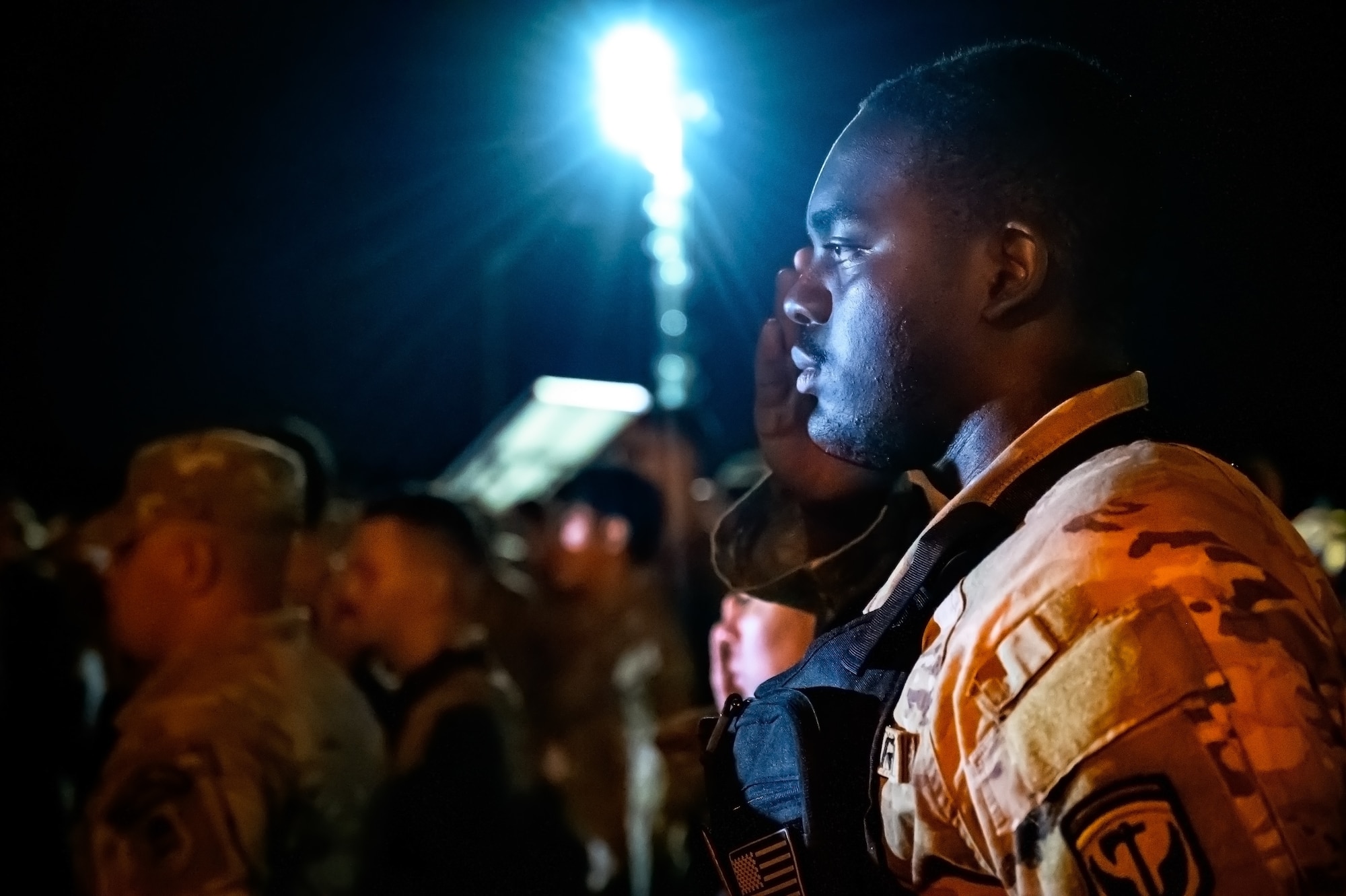 U.S. Army Staff Sgt. Brandon Carter, 17th Infantry Brigade infantryman, renders a salute during the opening ceremony for the Norwegian Foot March at JB MDL, N.J., Oct. 13, 2024. The Norwegian Foot March is a military endurance test where participants march or run an 18.6-mile-long route, carrying a rucksack of 24 lbs. (U.S. Air Force photo by Senior Airman Matt Porter)