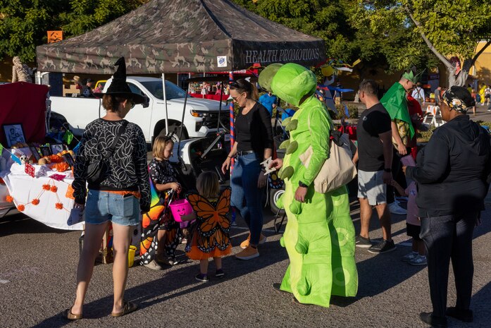 Families of Marines, Sailors and civilians, aboard Marine Corps Recruit Depot San Diego, participate in the MCRD San Diego annual Trunk-or-Treat event at MCRD San Diego, California, Oct. 25, 2024.  The trunk-or-treat event gives the Marines, Sailors, civilians and their families an opportunity to dress up and collect candy in a safe and controlled environment. (U.S. Marine Corps photo by Lance Cpl. Jacob B. Hutchinson)