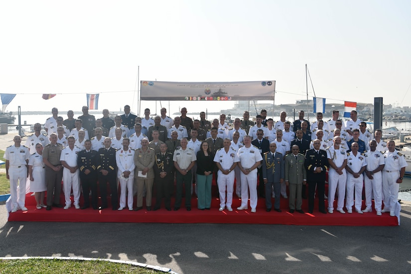 A large group of people pose for a photo.