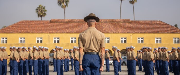 U.S. Marine Corps Staff Sgt. Jacob E. Landis, drill master with 3rd Recruit Training Battalion, Recruit Training Regiment, prepares to march new U.S. Marines with India Company, 3rd Recruit Training Battalion, prior to their graduation ceremony at Marine Corps Recruit Depot San Diego, California, Oct. 25, 2024. This ceremony marked the end of a 13-week transformation that included training in drill, marksmanship, basic combat skills, and Marine Corps customs and traditions. (U.S. Marine Corps photo by Lance Cpl. Janell B. Alvarez)