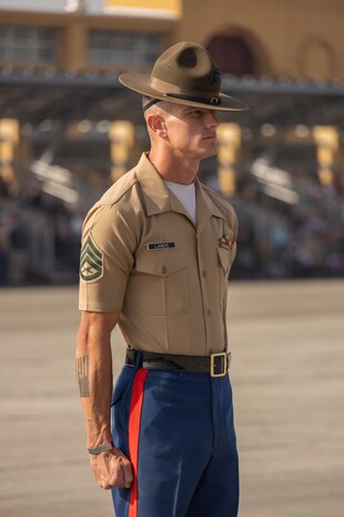 U.S. Marine Corps Staff Sgt. Jacob E. Landis, drill master with 3rd Recruit Training Battalion, Recruit Training Regiment, prepares to march new U.S. Marines with India Company, 3rd Recruit Training Battalion prior to their graduation ceremony at Marine Corps Recruit Depot San Diego, California, Oct. 25, 2024. This ceremony marked the end of a 13-week transformation that included training in drill, marksmanship, basic combat skills, and Marine Corps customs and traditions. (U.S. Marine Corps photo by Lance Cpl. Janell B. Alvarez)