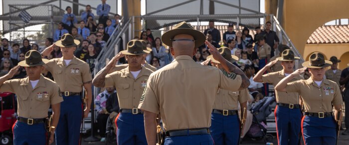 U.S. Marine Corps staff with India Company, 3rd Recruit Training Battalion, salute prior to being dismissed during a graduation ceremony at Marine Corps Recruit Depot San Diego, California, Oct. 25, 2024. This ceremony marked the end of a 13-week transformation that included training in drill, marksmanship, basic combat skills, and Marine Corps customs and traditions. (U.S. Marine Corps photo by Lance Cpl. Janell B. Alvarez)