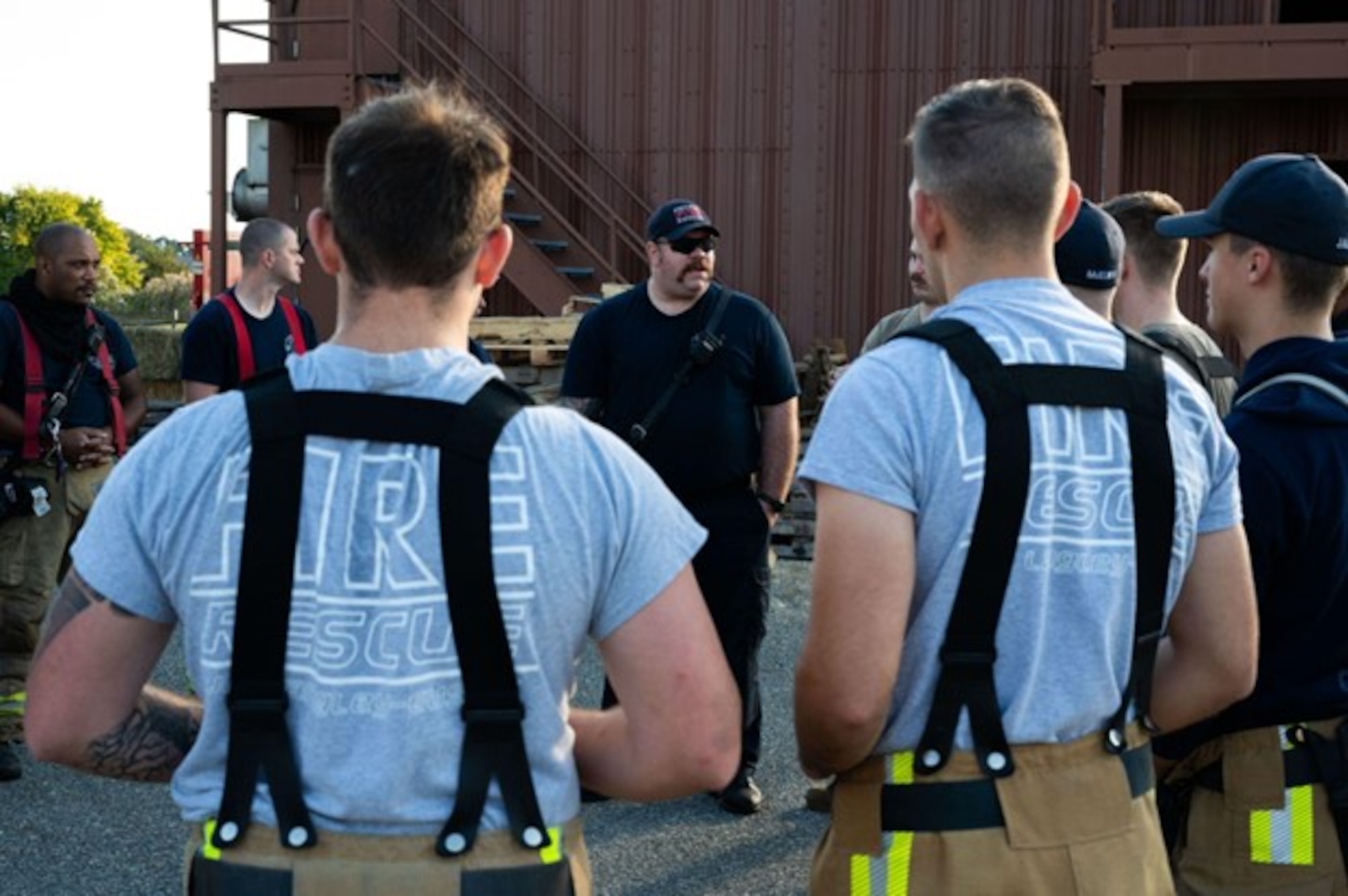 Firefighters and Airmen listen to a training brief. (U.S. Air Force photo by Airman Donnell Ramsey)