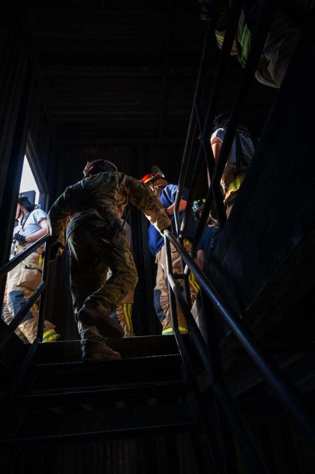 Firefighters exit building. (U.S. Air Force photo by Airman Donnell Ramsey)