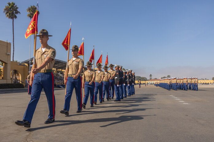 U.S. Marine Corps drill instructors with India Company, 3rd Recruit Training Battalion, march in formation while returning the guidons during a graduation ceremony at Marine Corps Recruit Depot San Diego, California, Oct. 25, 2024. This ceremony marked the end of a 13-week transformation that included training in drill, marksmanship, basic combat skills, and Marine Corps customs and traditions. (U.S. Marine Corps photo by Lance Cpl. Janell B. Alvarez)