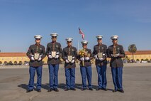 New U.S. Marine Corps honor graduates with India Company, 3rd Recruit Training Battalion, pose for a photo after a graduation ceremony at Marine Corps Recruit Depot San Diego, California, Oct. 25, 2024. This ceremony marked the end of a 13-week transformation that included training in drill, marksmanship, basic combat skills, and Marine Corps customs and traditions. (U.S. Marine Corps photo by Lance Cpl. Janell B. Alvarez)