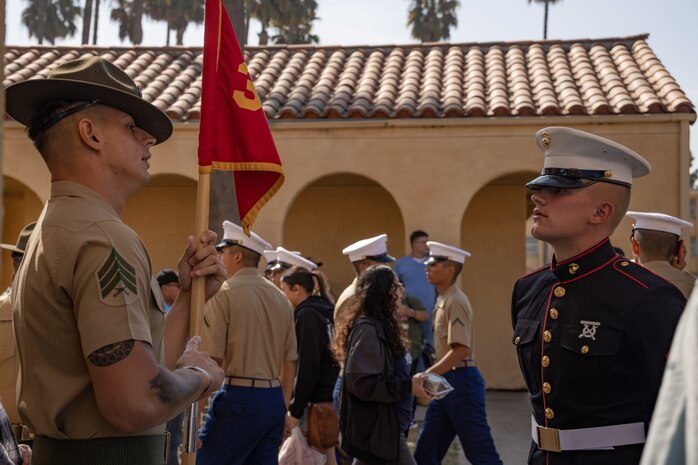 U.S. Marine Corps Sgt. Joseph C. Zerener, right, a drill instructor and Pfc. Crandon Dwyer both with India Company, 3rd Recruit Training Battalion, converse after a graduation ceremony at Marine Corps Recruit Depot San Diego, California, Oct. 25, 2024. This ceremony marked the end of a 13-week transformation that included training in drill, marksmanship, basic combat skills, and Marine Corps customs and traditions. (U.S. Marine Corps photo by Lance Cpl. Janell B. Alvarez)
