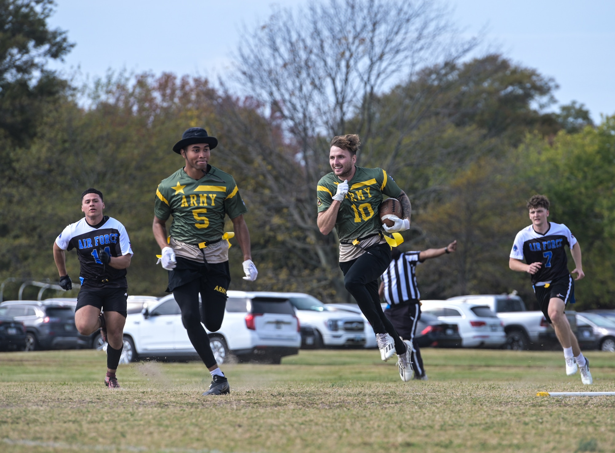 Football player running to avoid getting flag pulled